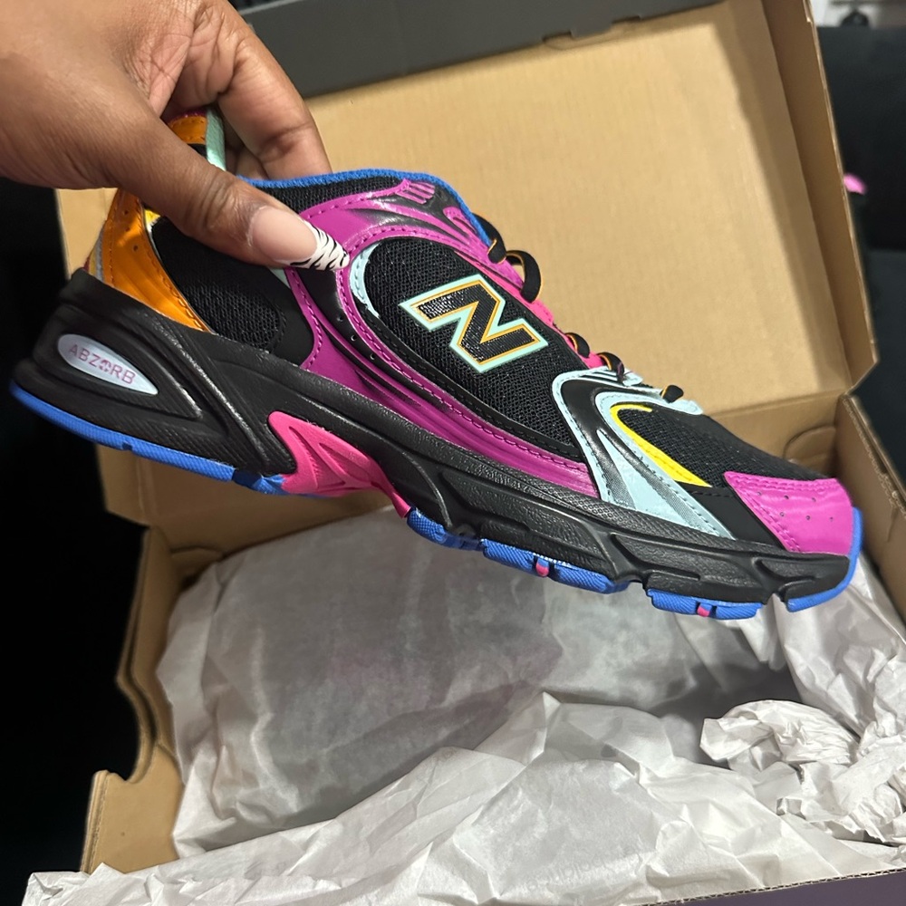 Urban Outfitters New Balance Black and Pink Sneakers
